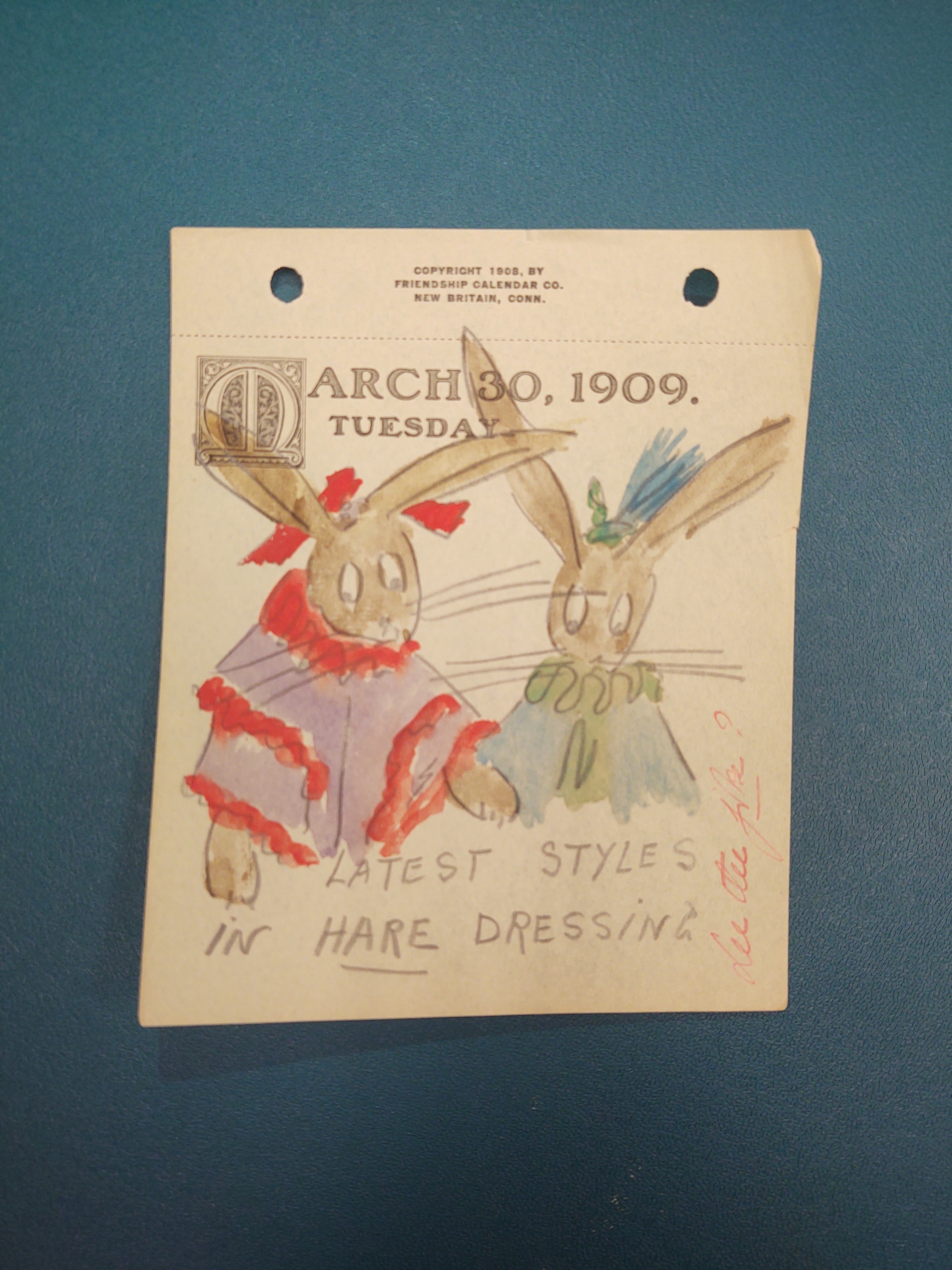 March 30, 1909. Tuesday: Two rabbits (or hares) next to each other. They are both dressed in fun and colorful clothing. This is right below the date on the middle of the page.