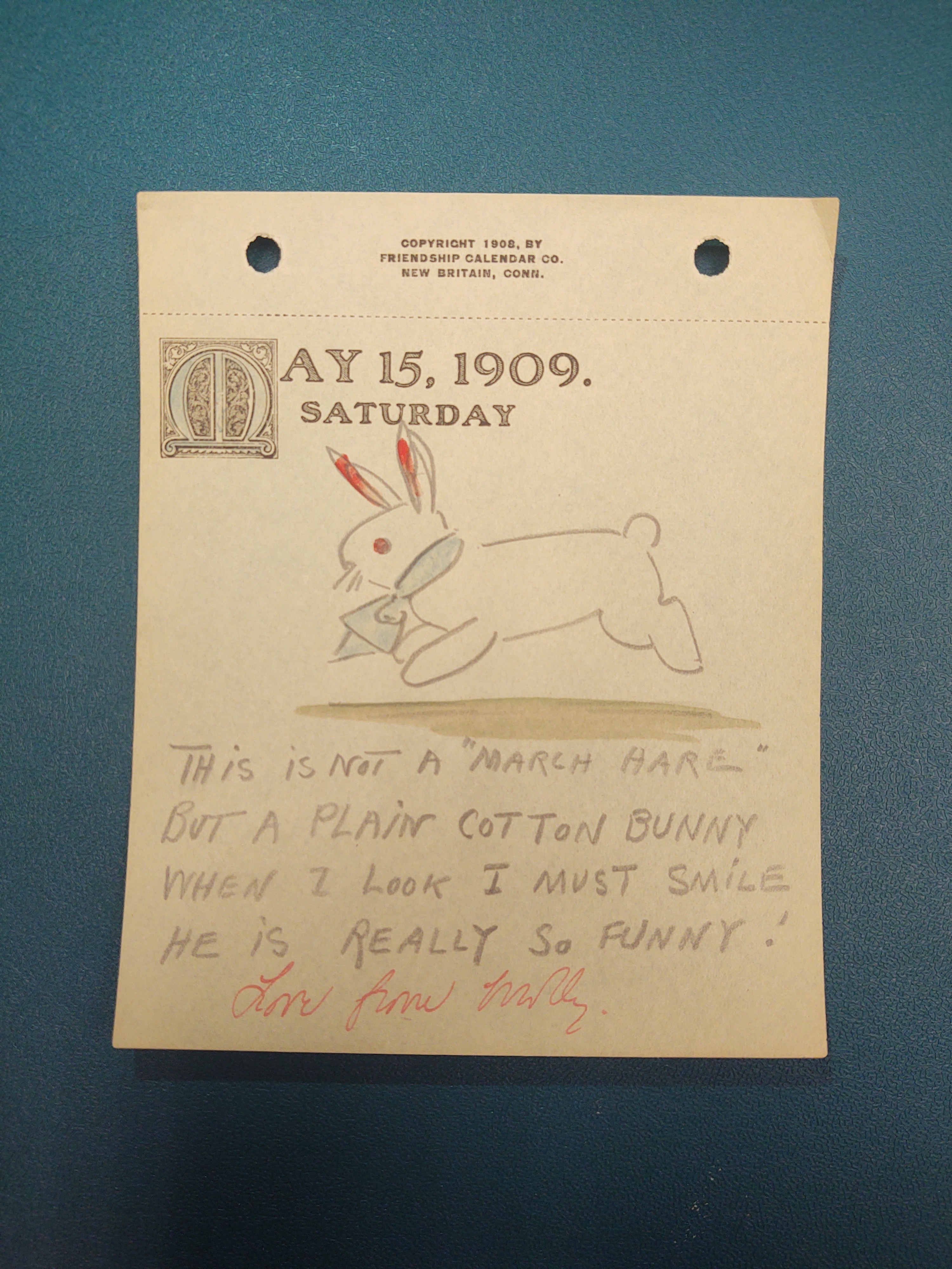 May 15, 1909. Saturday: Drawing of a bunnie that is hopping with a blue tie around its collar and red ears.